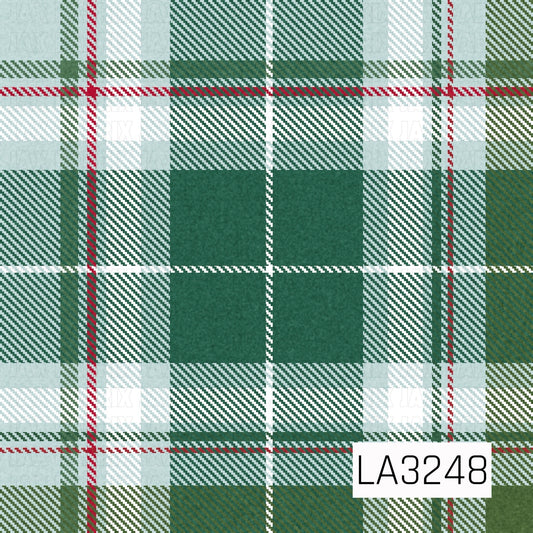 A classic holiday plaid featuring rich evergreen and blue spruce tones mixed with icy blue, soft white, and muted olive. Thin red accent stripes add a festive pop, while the textured tartan style gives it a cozy Christmas feel.
