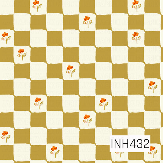 A playful checkerboard pattern featuring warm mustard gold and creamy ivory squares with a softly hand-painted, slightly imperfect texture. Select ivory squares are accented with tiny orange flowers and delicate leafy stems, adding a sweet vintage floral touch to the bold checkered design.
