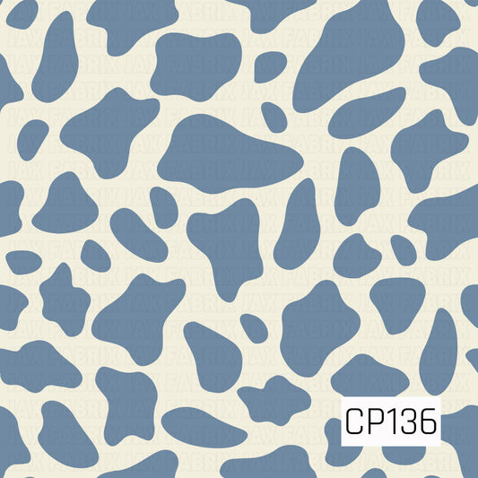 A classic cow print featuring dusty blue organic spots on a soft cream background. The simple two-tone design offers a timeless western-inspired look with a modern, muted color palette.
