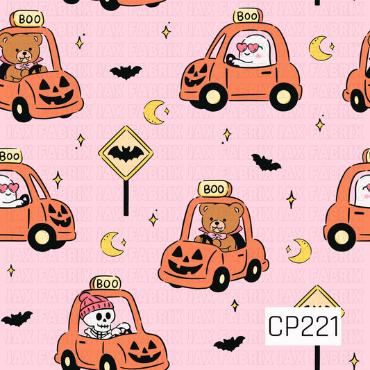 A cute Halloween seamless pattern featuring teddy bears, ghosts, and skeletons riding pumpkin-shaped cars with "BOO" signs, accented by bats, crescent moons, sparkling stars, and spooky road signs on a soft pink background.
