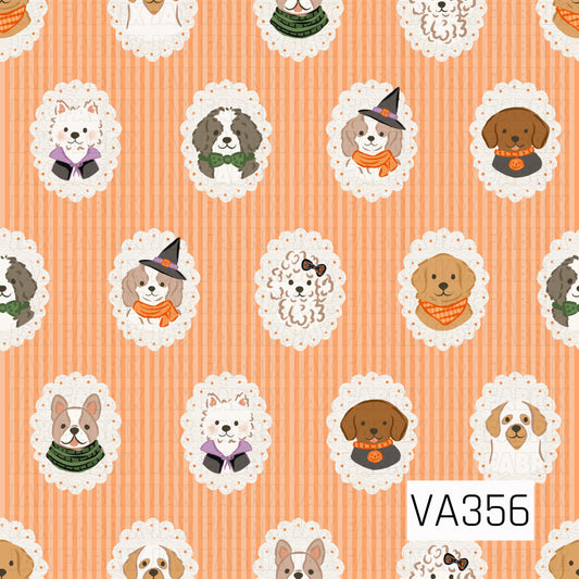 A playful Halloween dog print featuring adorable pups dressed in festive costumes and accessories. Each pup is framed in a scalloped cameo against a warm orange striped background for a cute, vintage-inspired Halloween look.

