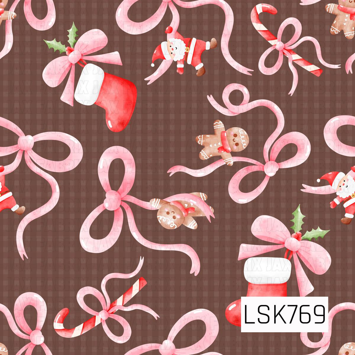 A whimsical Christmas design featuring oversized pink bows mixed with candy canes, stockings, gingerbread cookies, holly, and tiny Santas. A rich chocolate brown background paired with soft pinks and classic holiday reds gives this print a sweet, girly twist on traditional Christmas.