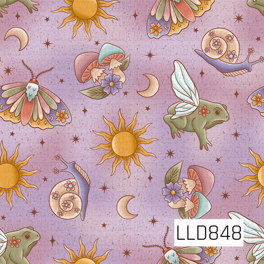 A whimsical seamless pattern featuring golden suns, crescent moons, pastel moths, fairy frogs with delicate wings, floral mushrooms, snails, and scattered stars on a soft lavender speckled background.
