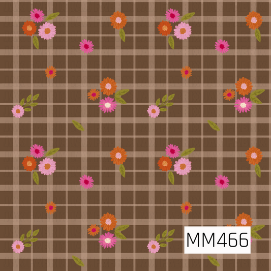 A warm fall floral plaid featuring a soft medium brown background layered with tan and cream intersecting lines. Scattered clusters of pink, blush, orange, and rust-colored flowers are paired with olive green leaves, creating a cozy vintage-inspired autumn design.