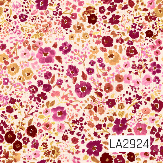 A delicate watercolor floral pattern featuring an abundance of painterly blooms, tiny blossoms, and leafy sprigs in shades of berry, burgundy, mauve, blush pink, dusty rose, and warm golden tan on a soft off-white background. The scattered botanical design and rich autumn-inspired palette create a romantic, vintage feel with timeless charm.
