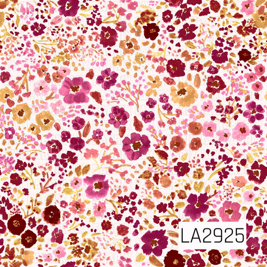 A delicate watercolor floral pattern featuring an abundance of painterly blooms, tiny blossoms, and leafy sprigs in shades of berry, burgundy, mauve, blush pink, dusty rose, and warm golden tan on a soft blush pink background. The scattered botanical design and rich floral palette create a romantic, vintage-inspired look with a warm and elegant feel.
