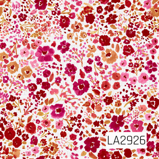 A vibrant watercolor floral pattern featuring an abundance of painterly blooms, tiny blossoms, and leafy sprigs in bold shades of crimson, berry, magenta, fuchsia, coral, and warm golden tan on a crisp white background. The lively botanical arrangement and rich color palette create a fresh, romantic design with timeless vintage-inspired charm.
