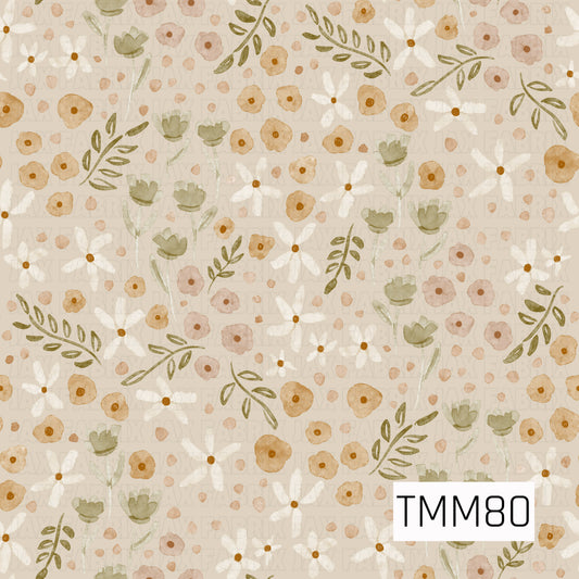 A soft watercolor floral pattern featuring warm mustard and dusty peach blooms, creamy white daisies, muted sage green flowers, and olive leafy sprigs. Set against a warm beige background with scattered petals throughout, the design has an earthy, vintage-inspired feel with a cozy neutral color palette.
