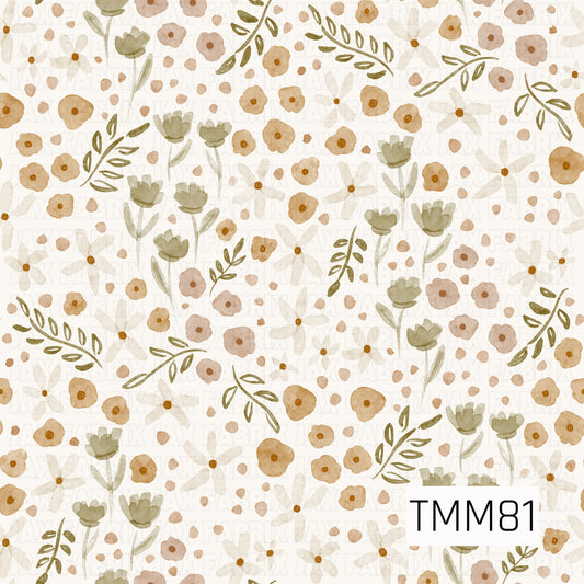 A delicate watercolor floral pattern filled with soft, hand-painted blooms and leafy sprigs. Warm mustard and dusty peach flowers are mixed with creamy white daisies, muted sage green florals, and olive-toned foliage on a soft ivory background. The scattered petals and airy arrangement give it a sweet, vintage-inspired botanical feel.
