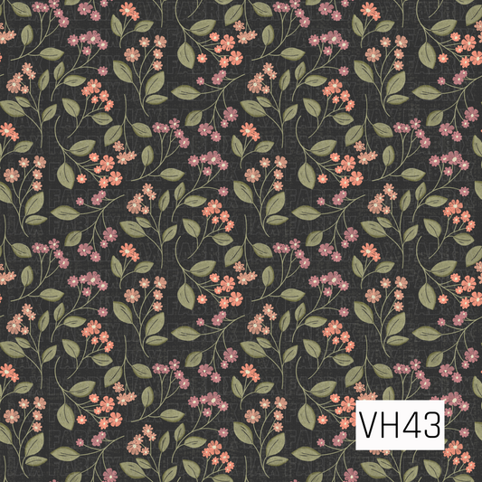 Delicate vintage floral pattern featuring small coral, blush, and dusty pink blooms with muted olive green leaves and winding stems against a dark charcoal background.
