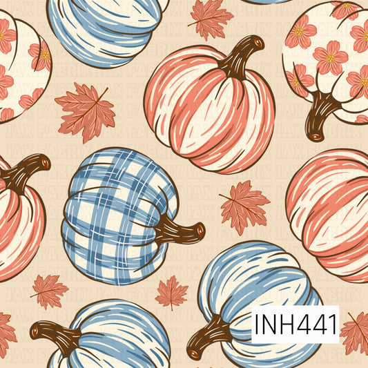 A playful fall pattern featuring hand-drawn pumpkins in coral pink, soft blue, cream, and blue plaid, mixed with floral-filled pumpkins and scattered autumn leaves. Set against a warm beige background with rich brown stems, the vintage-inspired palette gives it a cozy, whimsical autumn feel.
