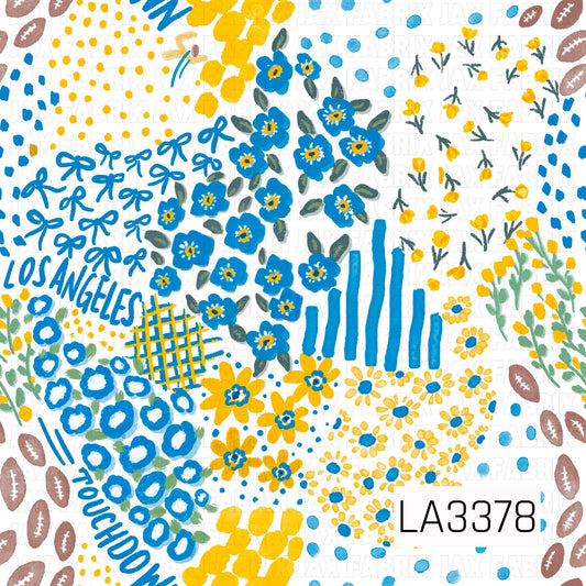A bright Los Angeles football-inspired print featuring bold blue and golden yellow with touches of green and white. Hand-painted florals, bows, footballs, scattered dots, sketchy stripes, and abstract accents are mixed with “Los Angeles” and “Touchdown” lettering for a colorful, playful game day look.

