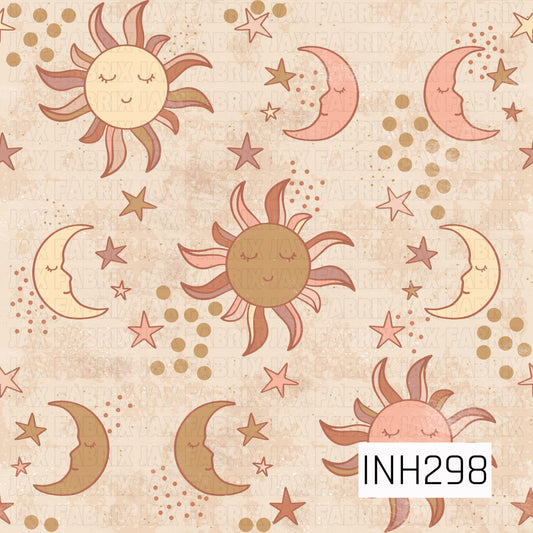 a celestial pattern of suns, moons and stars muted colors peach yellow tan and orange