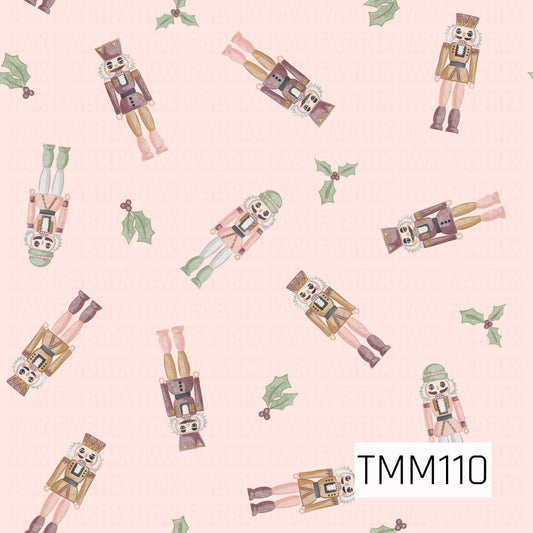 A whimsical Christmas seamless design featuring watercolor nutcrackers scattered throughout with festive holly accents. Soft shades of blush pink, plum, sage green, cream, and warm gold create a sweet, vintage-inspired holiday look against a pale pink background.
