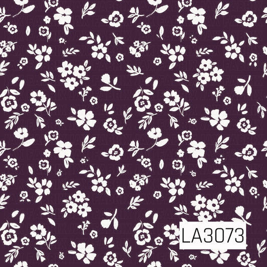 A delicate floral pattern featuring scattered white wildflowers, leafy sprigs, and petite blossoms across a rich dark plum-purple background. The hand-painted, slightly textured details create a charming vintage-inspired cottage feel with bold contrast.
