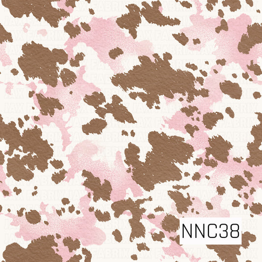A rustic cowhide-inspired pattern featuring irregular warm brown and soft blush pink patches scattered across a creamy white background. The textured, hand-painted finish gives it a soft, western feel with a fun feminine twist.
