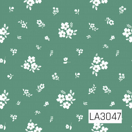 A charming scattered floral featuring creamy white blossoms, petite flower clusters, and delicate leafy sprigs across a soft meadow green background. The airy spacing and hand-painted texture give it a fresh, vintage cottage feel.
