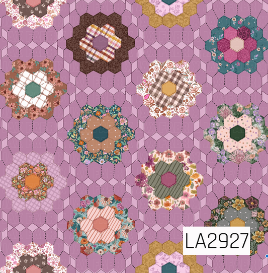 A charming patchwork-inspired pattern featuring floral hexagon quilt blocks arranged across a soft amethyst purple background. Each quilt motif showcases a unique mix of florals, plaids, polka dots, and textured prints in warm shades of mauve, blush, teal, mustard, sage, and brown, creating a cozy handcrafted design with a vintage heirloom feel.
