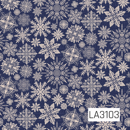 A detailed winter snowflake pattern featuring an assortment of hand-drawn snowflakes in soft cream and tan against a deep navy blue background. The mix of intricate shapes and varying sizes gives the design a warm, classic winter feel.
