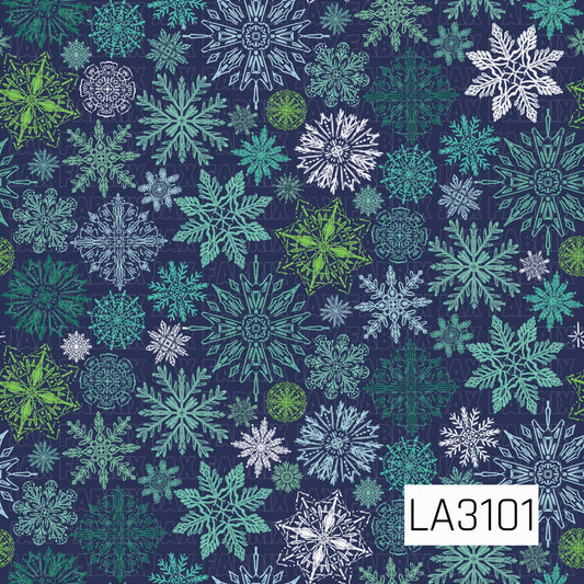 A winter snowflake pattern featuring an assortment of intricate, hand-drawn snowflakes in shades of teal, mint, icy blue, green, and white. The varied snowflake shapes and sizes are scattered across a deep navy blue background for a bold, frosty winter look.
