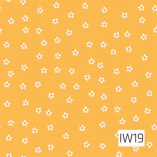 A cheerful floral pattern featuring tiny white five-petal daisies with warm golden centers scattered across a sunny golden yellow background. The evenly spaced flowers create a sweet, playful design with a charming vintage-inspired feel, perfect for spring and summer.