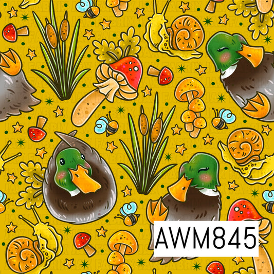 A whimsical woodland-themed pattern featuring adorable mallard ducks with green heads and brown feathers, surrounded by cattails, mushrooms, snails, bees, and tiny star accents. The design is scattered across a warm golden-yellow background with small dots and sparkles, creating a playful nature-inspired aesthetic with charming autumn and cottagecore vibes.