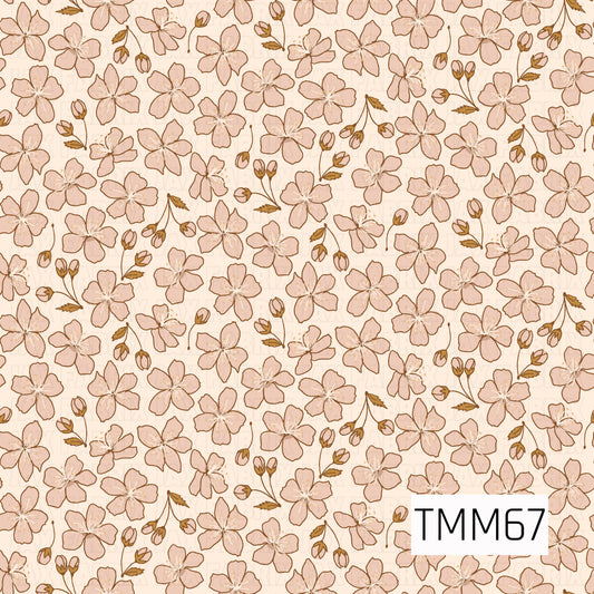A soft hand-drawn floral pattern featuring dusty blush pink blossoms scattered with petite buds and warm golden-brown leaves. Delicate cream centers and fine brown outlines add subtle detail, all set against a warm ivory background for a sweet, vintage botanical feel.
