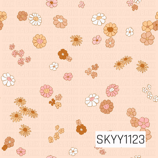 A playful scattered floral seamless pattern featuring hand-drawn daisies and petite blossoms in warm caramel, peach, soft pink, cream, and white. The light peach background and whimsical mix of flower shapes give the design a sweet, retro-inspired fall feel.
