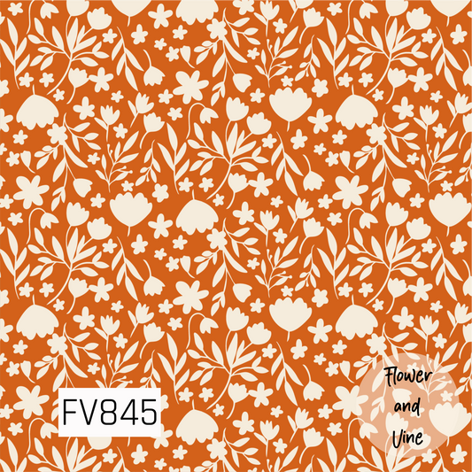 A warm botanical print featuring cream flowers, leafy branches, and delicate floral sprigs scattered across a rich burnt orange background. The simple silhouette-style florals give the design a cozy, retro-inspired feel that is perfect for fall and autumn projects.
