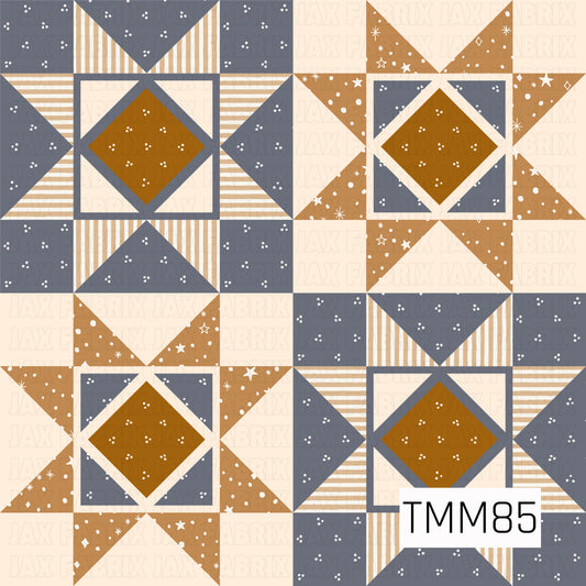 A cozy quilt-inspired geometric pattern featuring repeating star and diamond blocks in slate blue, warm mustard, tan, and cream. Striped sections, tiny floral speckles, and scattered celestial accents add texture and detail, creating a warm vintage handcrafted look.
