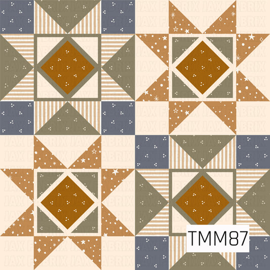 A cozy quilt-inspired geometric pattern featuring repeating star and diamond blocks in warm mustard, muted olive green, slate blue, tan, and cream. Striped sections, tiny floral speckles, and scattered celestial accents add texture and detail, giving the design a warm vintage handcrafted feel.
