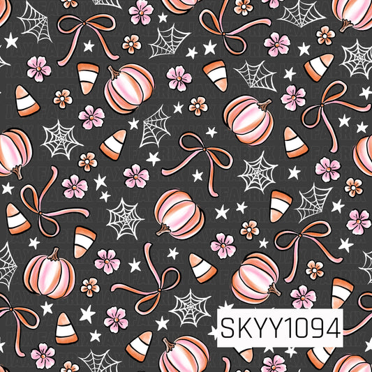 A sweet Halloween seamless pattern featuring soft pink pumpkins, candy corn, delicate pink bows, tiny pink flowers, white spider webs, and scattered white stars on a charcoal gray background. The blend of blush pink, peach, orange, and white creates a charming, feminine Halloween design with a playful preppy aesthetic.
