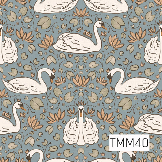 An elegant repeating pattern of graceful white swans surrounded by sage green lily pads, warm brown lotus flowers, and delicate botanical details on a soft dusty blue background. The hand-drawn artwork and muted earthy palette create a timeless, peaceful design inspired by serene pond landscapes.
