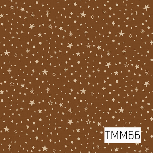 A playful celestial pattern featuring hand-drawn stars, sparkles, diamonds, and scattered dots in a soft cream color. Set against a rich warm brown background, the irregular shapes and textured details give it a whimsical, hand-painted feel.

