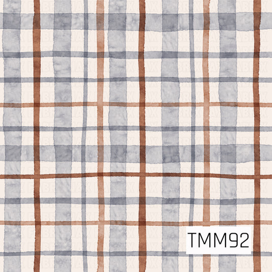 A soft watercolor plaid pattern featuring layered stripes in dusty blue, warm rust brown, and cream. The hand-painted lines vary in width and opacity, creating a cozy, slightly imperfect woven look with a muted neutral color palette.
